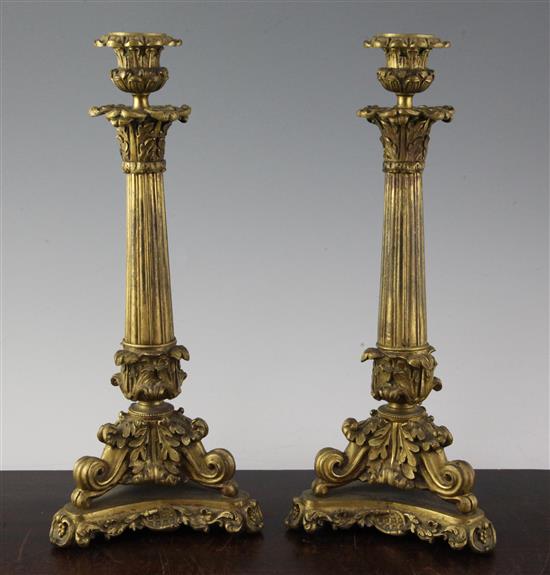 A pair of William IV ormolu candlesticks, 13.5in.